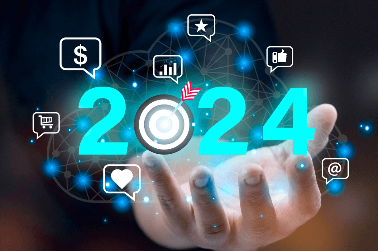 Silbo Money-blog-Mano de persona con el número 2024 y emojis de dinero, estrellas, like, insights, arroba, me gusta, carrito de la compra.